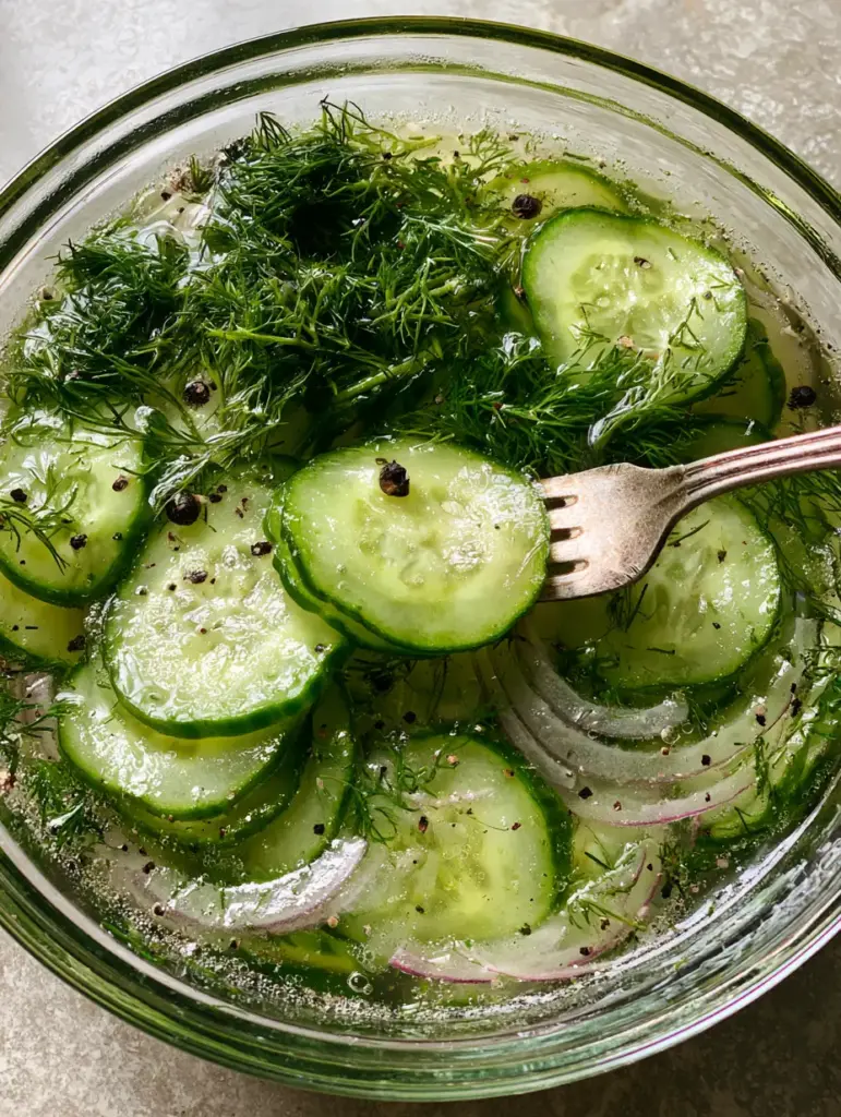 Cucumbers and Onions in Vinegar: The Ultimate Crisp Summer Salad 2 Close up of paper-thin English cucumbers and red onions in a shimmering vinegar brine. (Cucumbers and onions in vinegar)