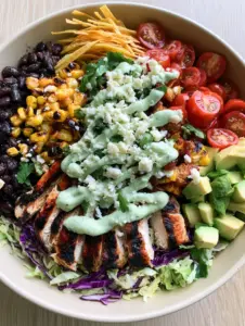 Detailed shot of Southwest Chicken Chopped Salad featuring sliced seared chicken and vibrant purple cabbage.