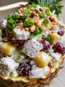 Close up of Hawaiian chicken salad showing tender white meat and glossy white dressing.