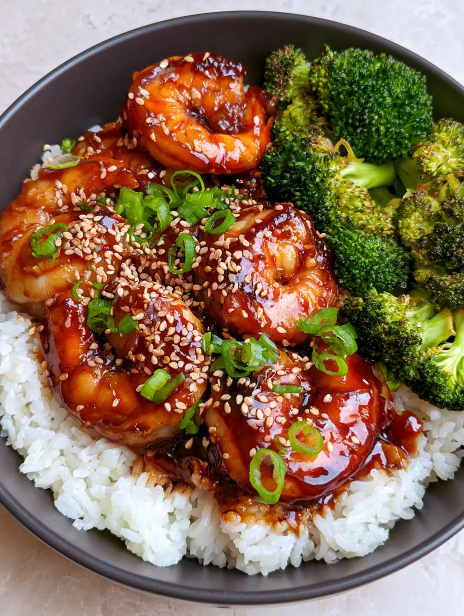 Teriyaki Shrimp Rice Bowls with Blistered Broccoli 3 Handheld smartphone photo showing the glossy mahogany-colored teriyaki glaze on jumbo seared shrimp over jasmine rice. (Teriyaki Shrimp Rice Bowls)