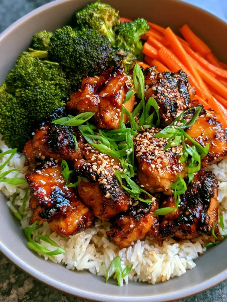 Close-up of glistening amber honey garlic chicken with charred edges and sesame seeds. (dinner ideas for picky eaters)