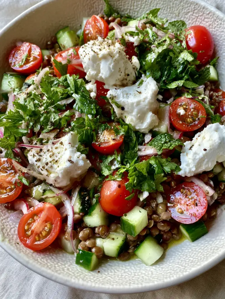 Lentil Salad: The Ultimate Vibrant Mediterranean Recipe 2 Top-down macro photo of Lentil Salad showing firm green lentils, translucent red onion slivers, and glossy vinaigrette pooling in crevices.