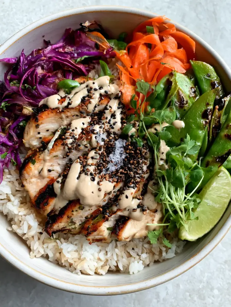 Healthy Dinners: Seared Lemon-Herb Chicken and Roasted Cabbage Grain Bowls 1 Close up of charred snap peas and ribboned carrots in a ceramic bowl, part of our healthy dinners collection.