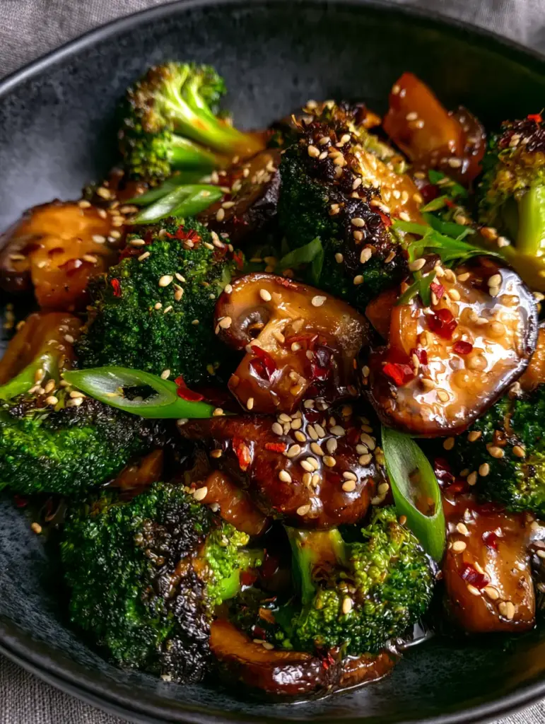 Vegan Broccoli and Mushroom Stir Fry: The Ultimate 20-Minute Dinner 1 Close-up of golden-brown seared cremini mushrooms and bias-cut scallions in a Vegan Broccoli and Mushroom Stir Fry.