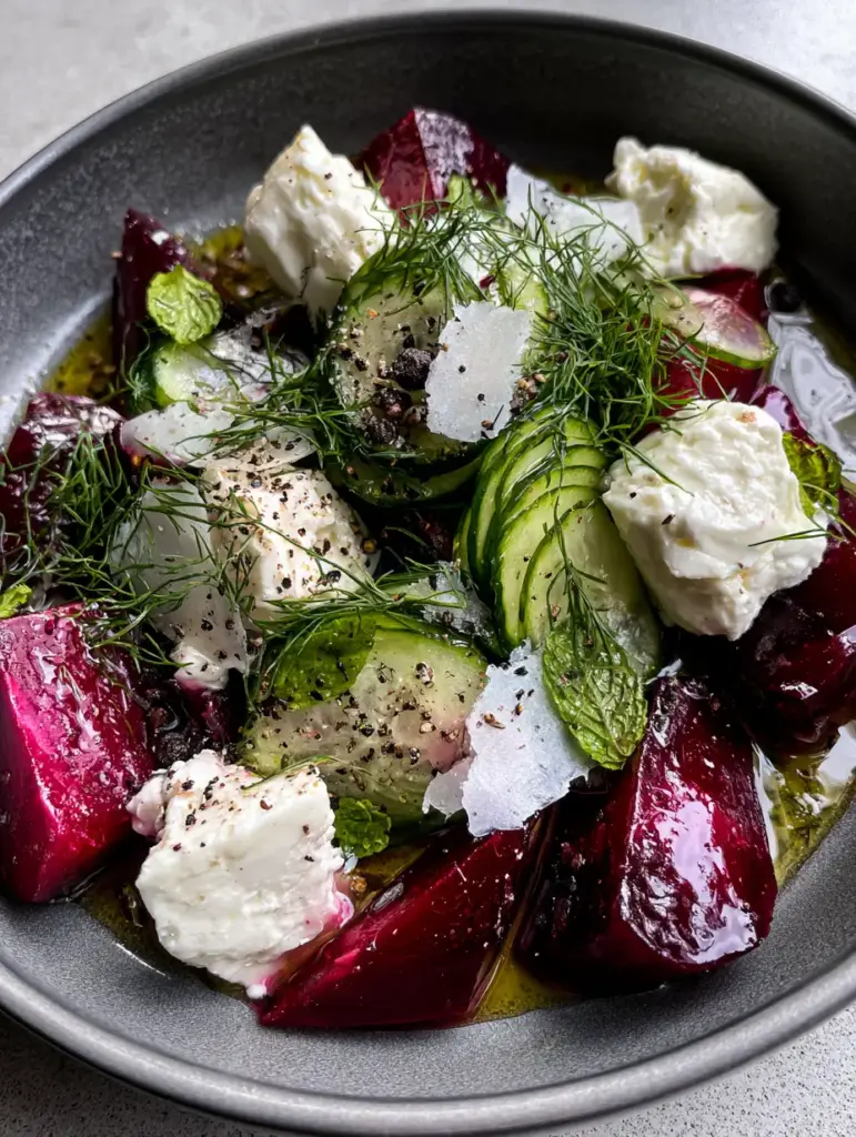 Beet Cucumber Salad with Roasted Ruby Red Wedges and Creamy Feta 1 Gourmet Beet Cucumber Salad with large crumbles of sheep milk feta and fresh dill fronds.