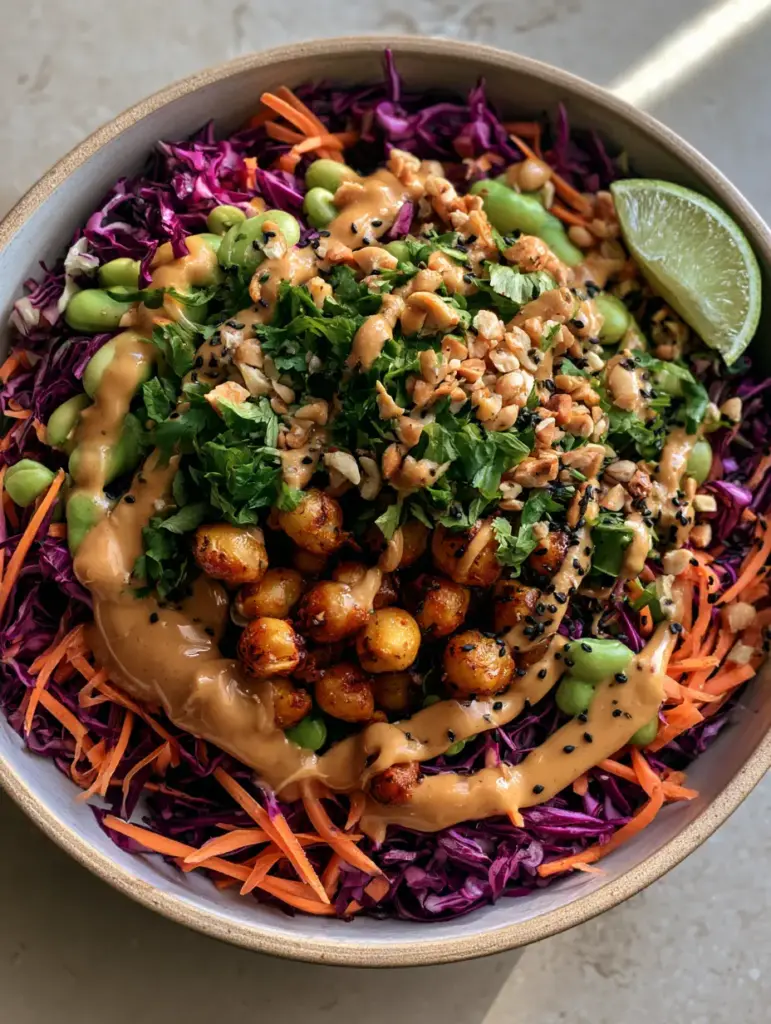 Crunchy Thai Chickpea Salad with Creamy Peanut Dressing 2 Close-up of blistered golden-brown chickpeas and bright orange julienned carrots in a Crunchy Thai Chickpea Salad.
