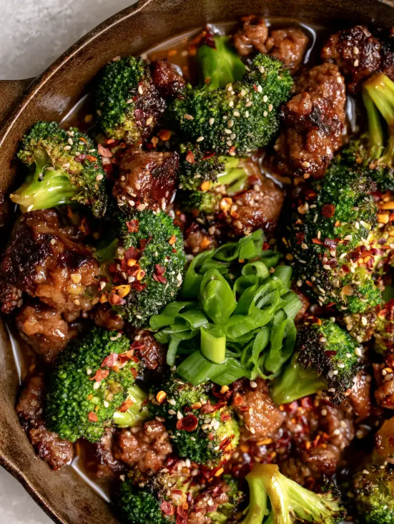 Easy Beef Recipes: 20-Minute Garlic Butter Ground Beef and Charred Broccoli 1 Close up of the shimmering garlic butter glaze coating ground beef and charred broccoli.