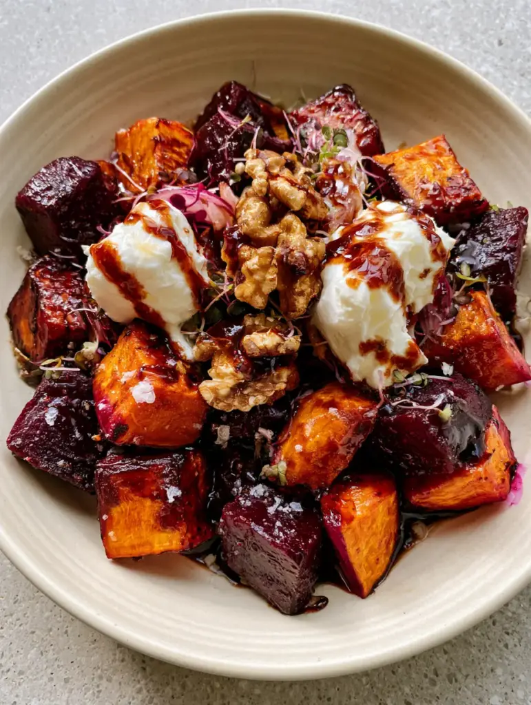Roasted Beet Sweet Potato Salad Recipe with Maple Balsamic Glaze 1 Detailed macro photo of roasted beets, golden sweet potatoes, and toasted walnuts with coarse sea salt.